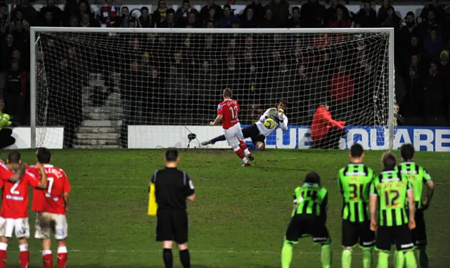 Petr Brezovan of Brighton & Hove Albion saves from Dean Keates of AFC Wrexham during the penalty shoot out