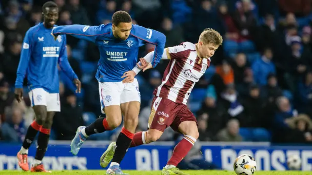 Rangers' Cyriel Dessers and St Johnstone's Max Kucheriavyi