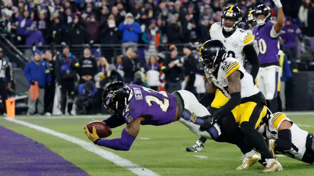 Derrick Henry scores a touchdown for the Baltimore Ravens against the Pittsburgh Steelers