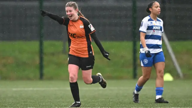 Millie Isherwood of London Bees celebrates scoring a goal against QPR