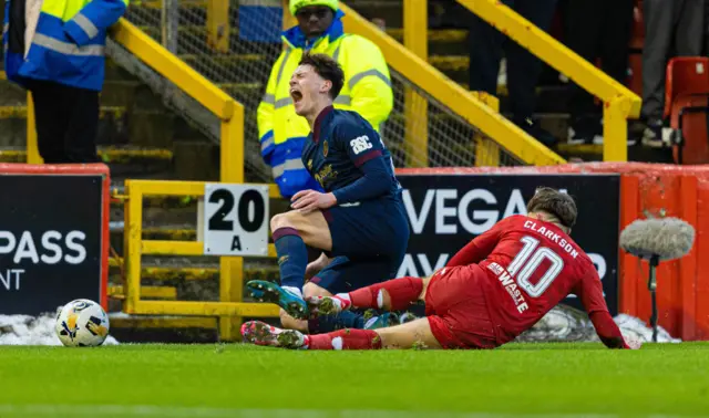 Hearts' James Penrice is tackled by Aberdeen's Leighton Clarkson