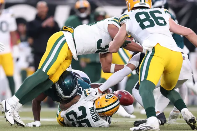 Philadelphia Eagles linebacker Oren Burks causes a fumble by Keisean Nixon of the Green Bay Packers