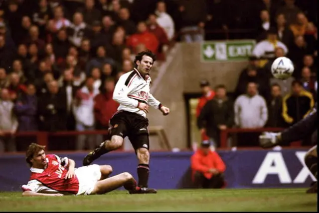 Ryan Giggs of Manchester United beats the despairing lunge of Tony Adams