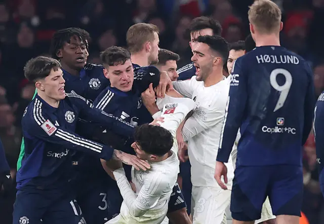 Alejandro Garnacho of Manchester United clashes with Kai Havertz