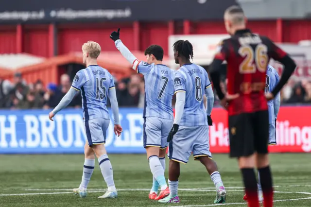 Tottenham players celebrate after scoring against Tamworth