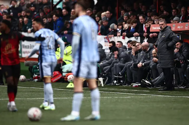 Ange Postecoglou looks on