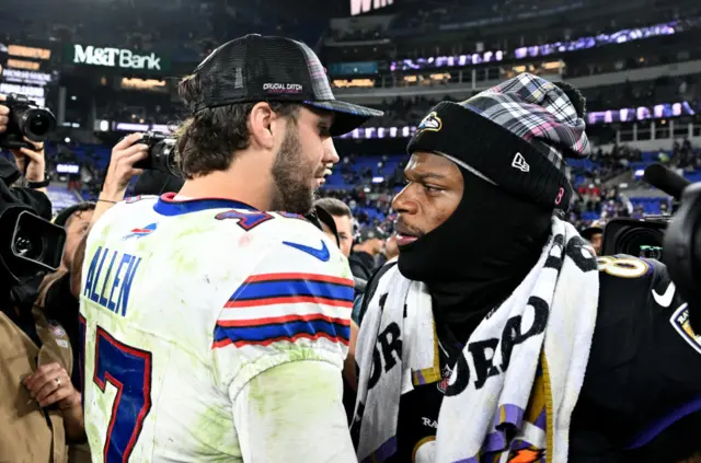 Josh Allen #17 of the Buffalo Bills and Lamar Jackson #8 of the Baltimore Ravens embrace