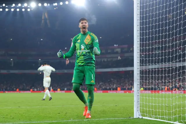 Altay Bayandir celebrates after saving Kai Havertz' penalty