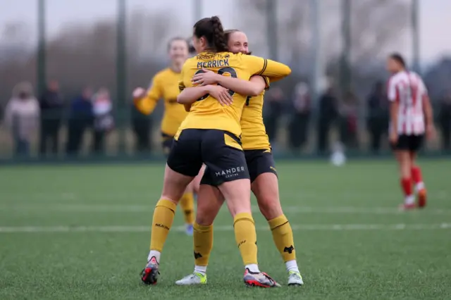 Beth Merrick of Wolverhampton Wanderers celebrates scoring her team's second.