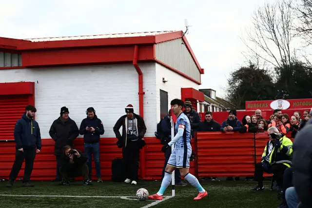 Son Heung-Min prepares to take a corner kick