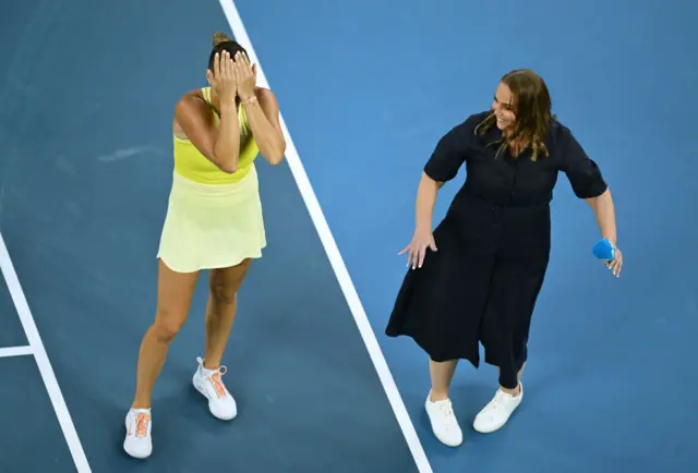 Sabalenka covers her face