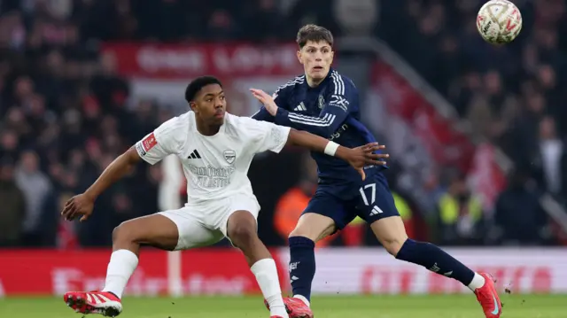 Arsenal's Myles Lewis-Skelly in action with Manchester United's Alejandro Garnacho