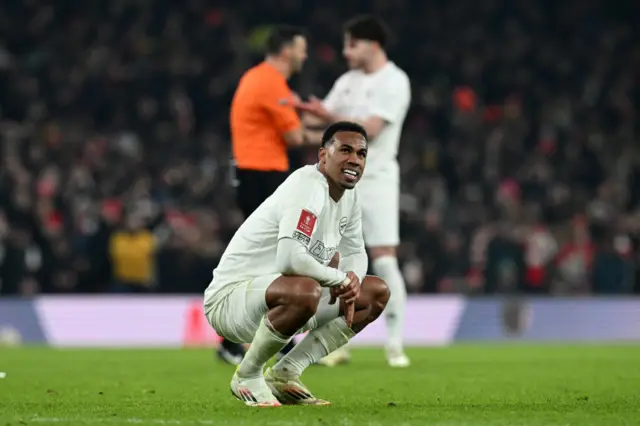 Gabriel looks on after the end of extra time between Arsenal and Man Utd