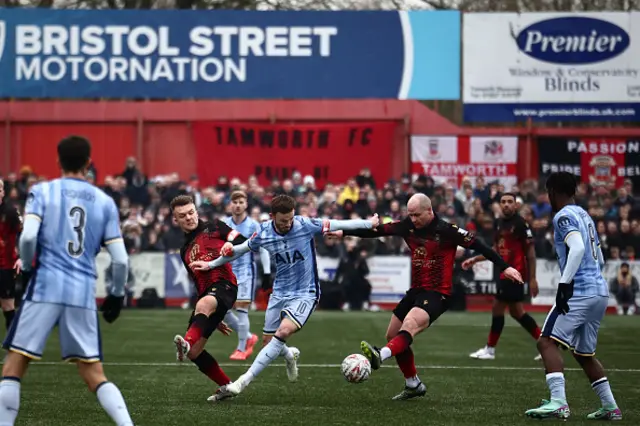 James Maddison (C) vies with Tamworth's English midfielder #04 Tom Tonks