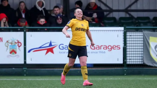 Amber Hughes celebrates