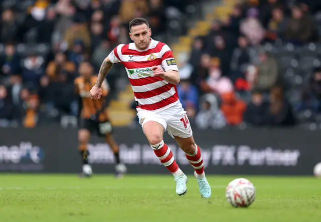 Billy Sharp of Doncaster Rovers chases the ball