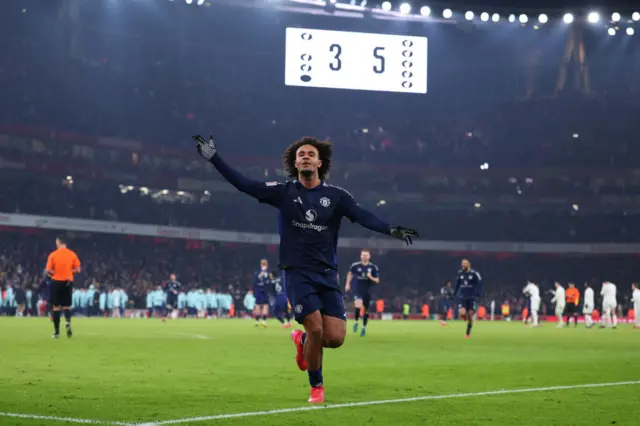 Joshua Zirkzee celebrates after scoring the winning penalty