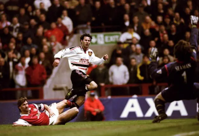 Ryan Giggs of Manchester United beats the despairing lunge of Tony Adams