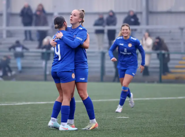 Mai Moncaster of Rugby Borough celebrates scoring her team's third goal.