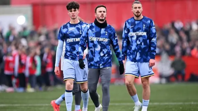 James Maddison, Archie Gray and Radu Dragusin of Tottenham Hotspur warm up