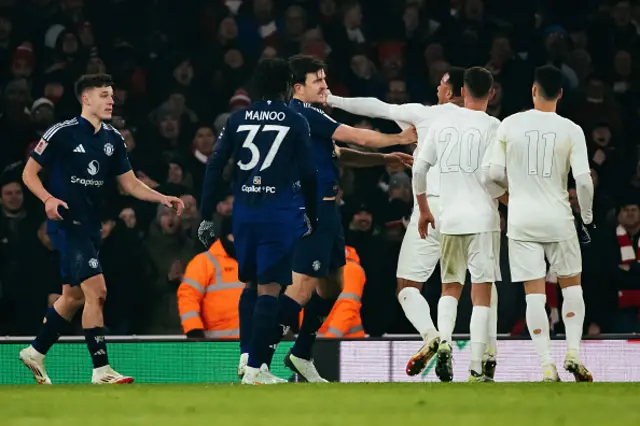 Harry Maguire of Manchester United clashes