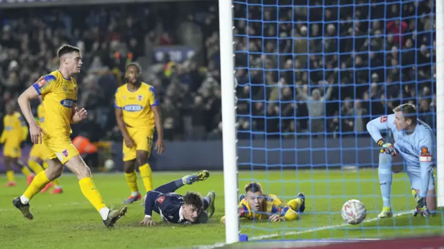 Mihailo Ivanovic finishes with his head while lying on the floor