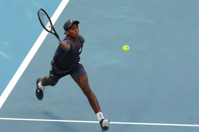 basavareddy reaches for a forehand