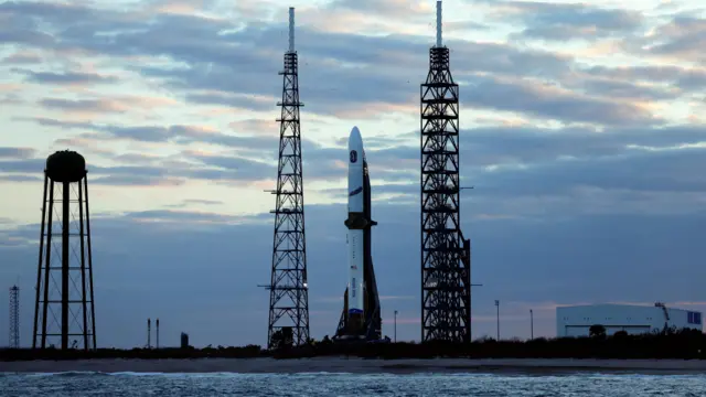 The white New Glenn rocket stands ready for launch