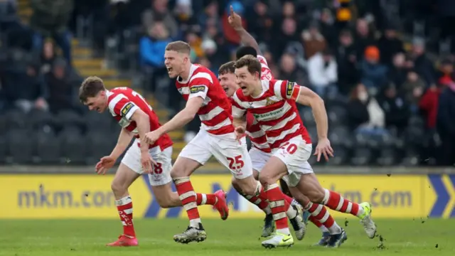 Doncaster players celebrate