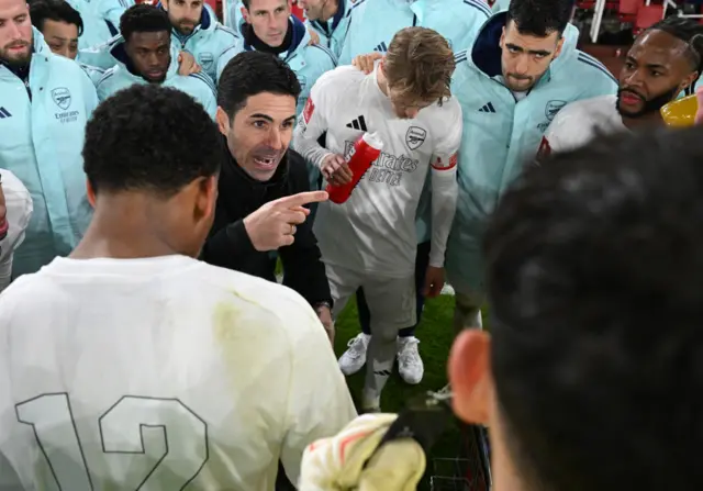 Arsenal boss Mikel Arteta gives a team-talk on the pitch before losing in the FA Cup on penalties to Manchester United