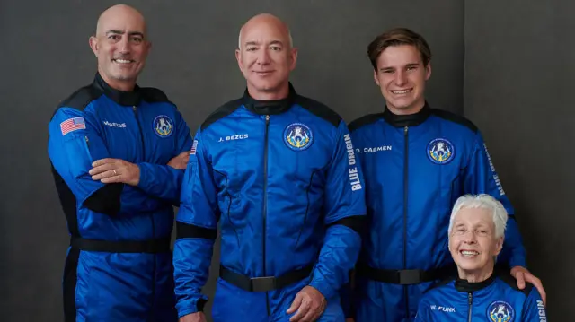 Mark Bezos, Jeff Bezos, Oliver Daemen and Wally Funk in blue spacesuits