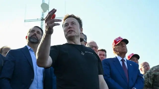 Elon Musk speaks with guests including Donald Trump Jr. (L) and U.S. President-elect Donald Trump (2nd from R) at a viewing of the launch of the sixth test flight of the SpaceX Starship rocket on November 19, 2024 in Brownsville, Texas