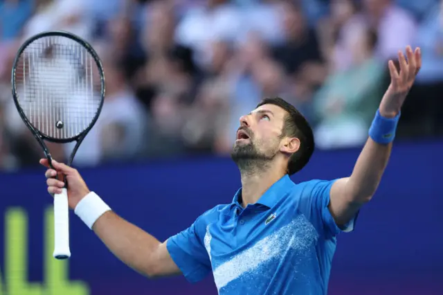 Novak Djokovic looks to the sky