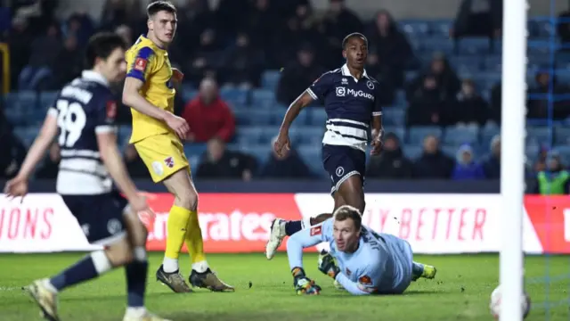 Ra'ees Bangura-Williams scores Millwall's third goal against Dagenham & Redbridge