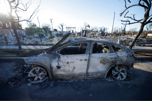 Remains of a Tesla electric car in Pacific Palisades neighbourhood