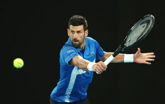 Djokovic plays a backhand