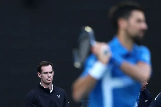 Andy Murray watches on as Novak Djokovic plays