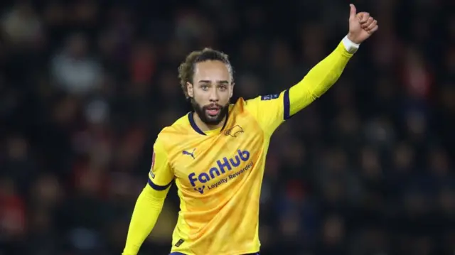 Derby winger Marcus Harness gives a thumbs up