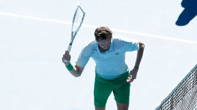 Daniil Medvedev smashes his racquet