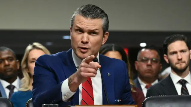 Pete Hegseth points as he speaks at the hearing