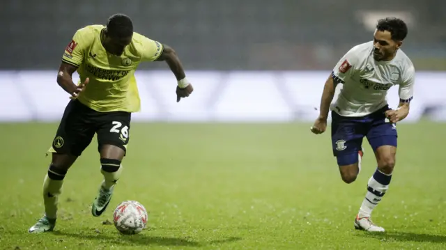 Charlton's Thierry Small takes on Preston's Duane Holmes