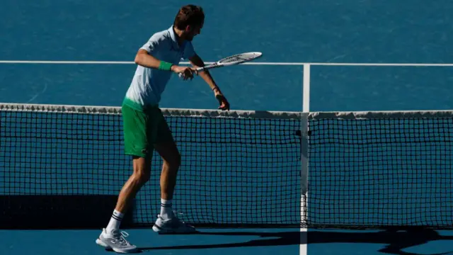 Daniil Medvedev smashes his racquet