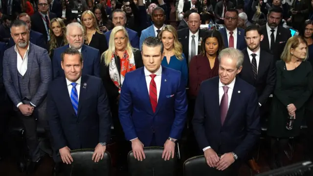 Hegseth stands in front of the committeee