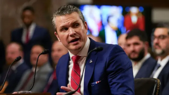 Hegseth speaking into a microphone