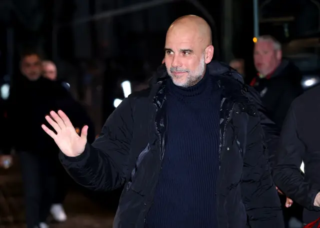 Pep Guardiola waves