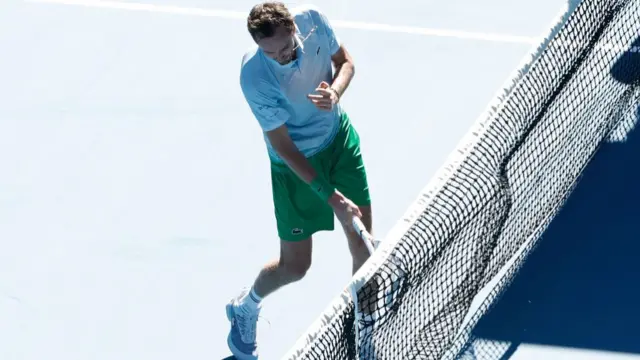 Daniil Medvedev smashes his racquet