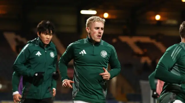 DUNDEE, SCOTLAND - JANUARY 14: Celtic's Luke McCowan warms up during a William Hill Premiership match between Dundee and Celtic at the Scot Foam Stadium at Dens Park, on January 14, 2025, in Dundee, Scotland. (Photo by Craig Foy / SNS Group)