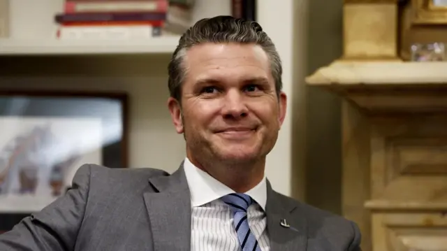 Pete Hegseth in suit and tie