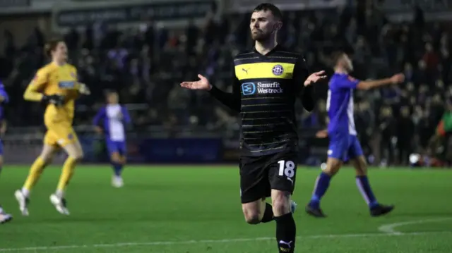 Wigan's Jonny Smith celebrates scoring against Carlisle in the FA Cup first round