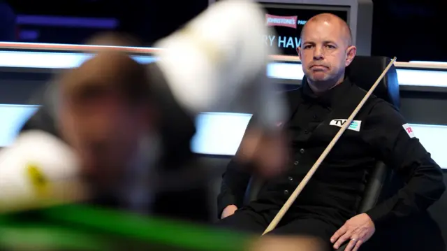 Barry Hawkins sits in his chair